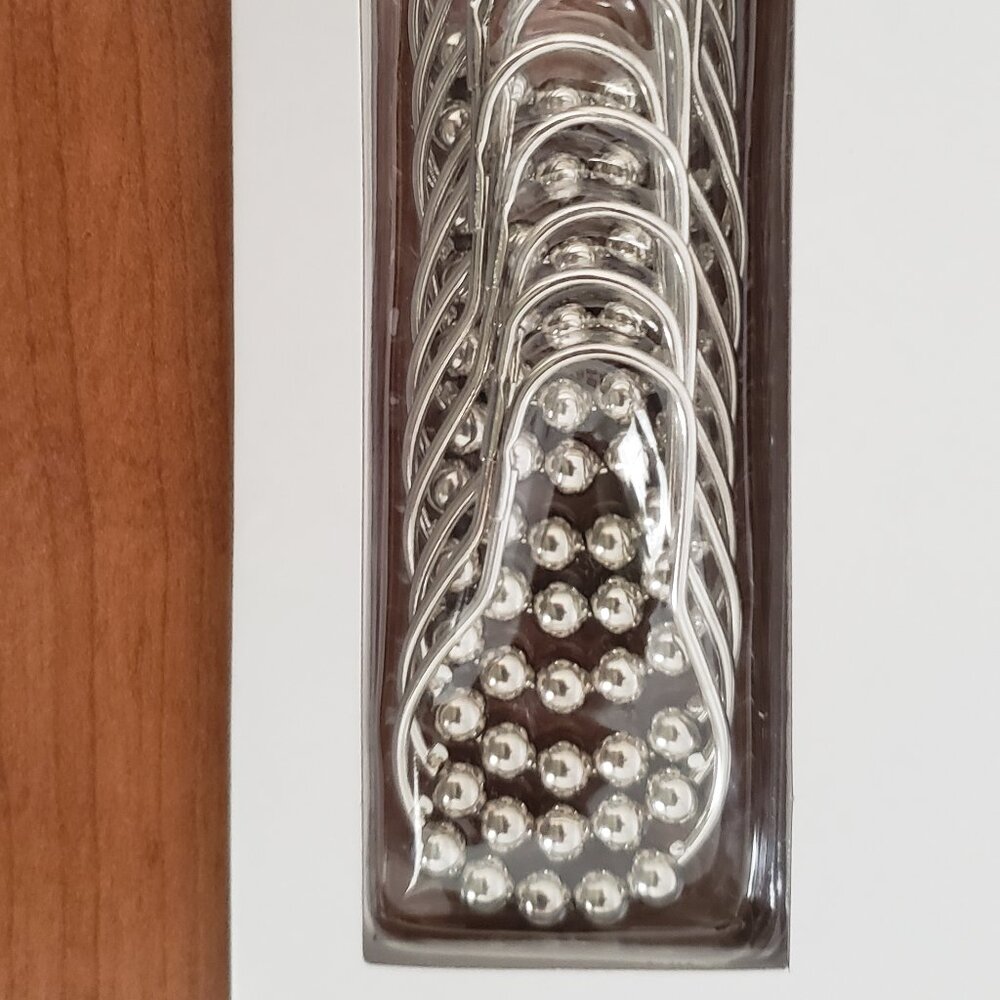Shower curtain rings - still in the package - never used.